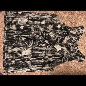 Black and white sleeveless front ruffle shirt